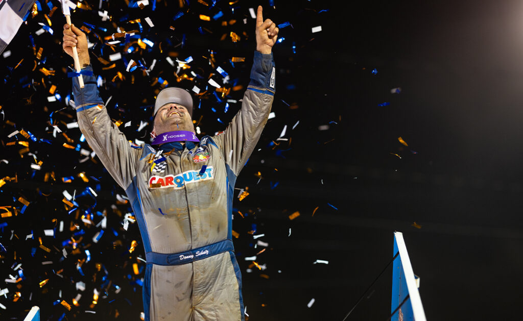 Donny Schatz with hands raised in celebration in victory lane