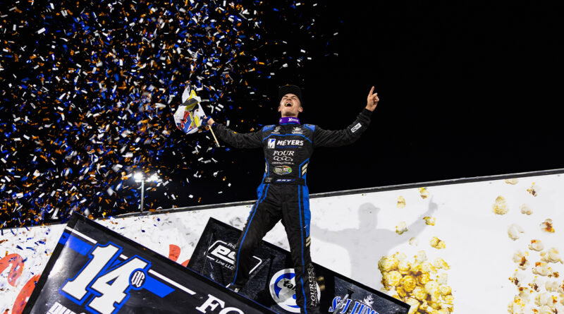 Cory Day atop his car - photo by Trent Gower